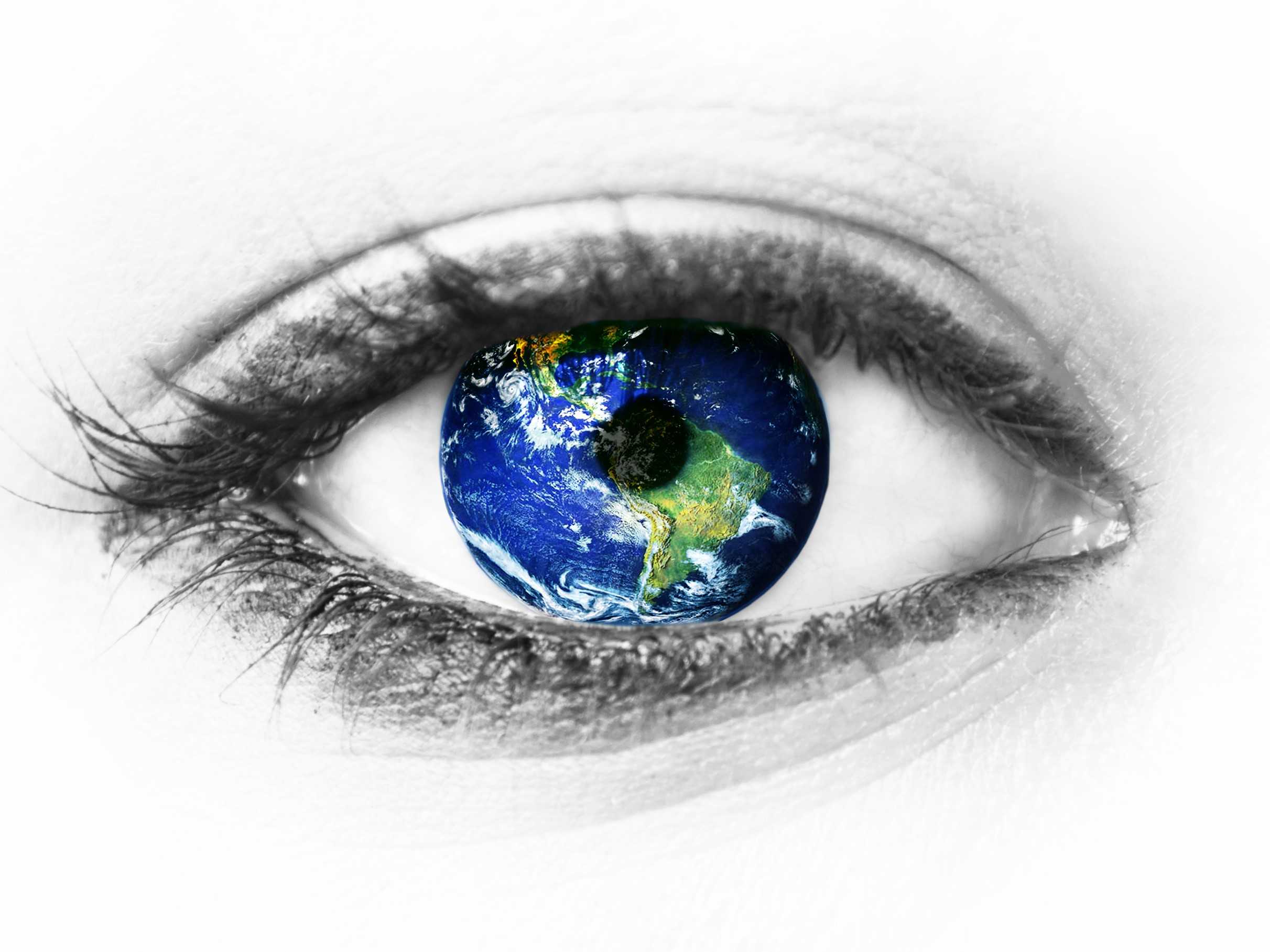 A human eye with the Earth reflected in the iris